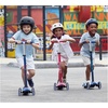 image:imageMicro Kickboard  Maxi LED Kids Scooter for Ages 512  Children up to 110 lbs  3 Wheel LeantoSteer Design  Adjustable T Bar  Smooth Ride Motion Activated PU LED Wheels  Swiss DesignAqua with pink graphics